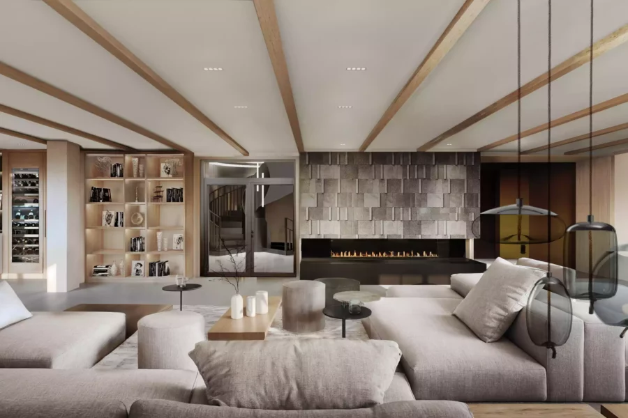 Moderne Lounge mit großem Kamin, beige Sofas, Holzdeckenbalken und beleuchtetem Bücherregal in Boutique Resort Schwarzwald