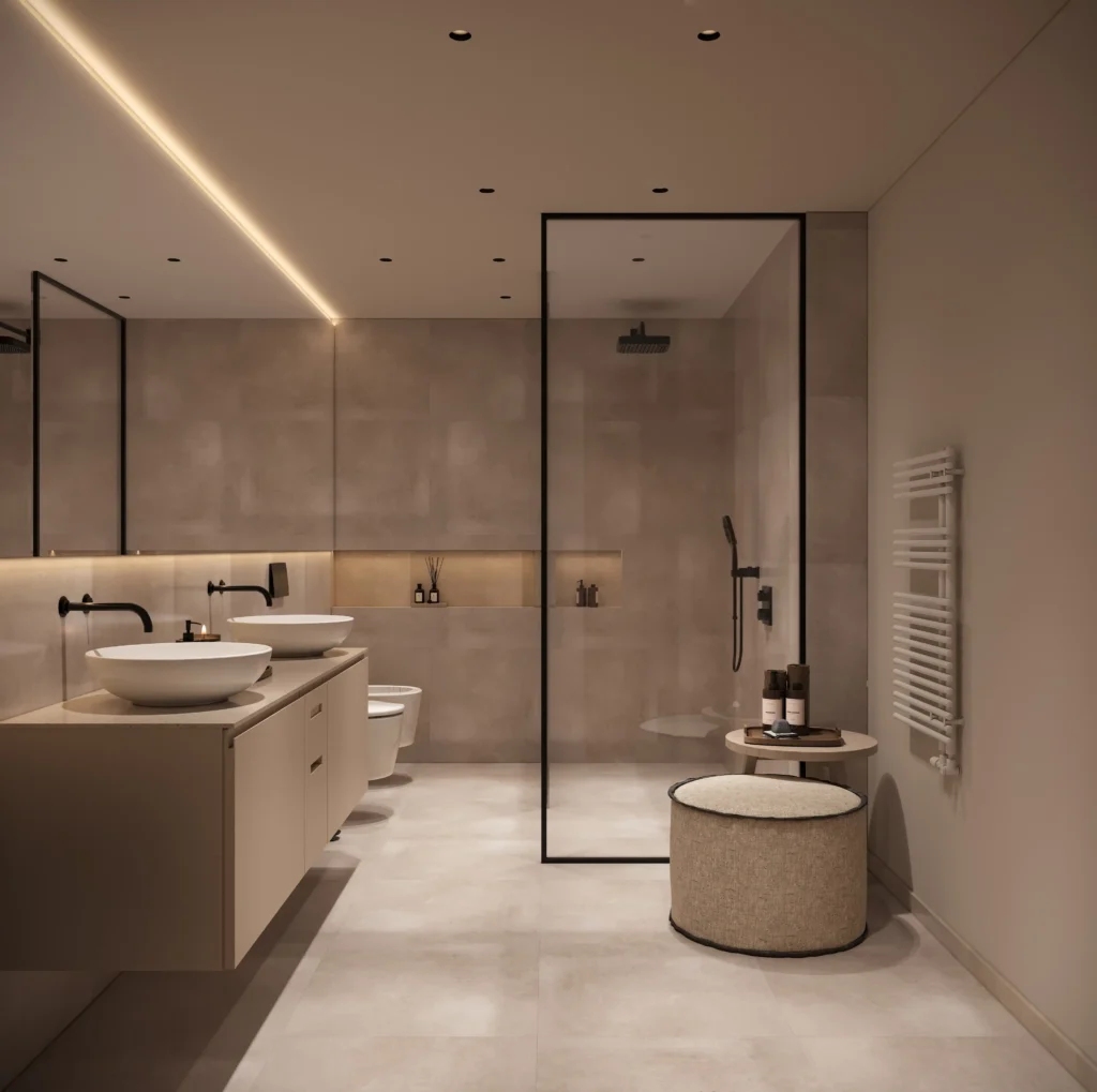 Modernes Badezimmer mit Doppelwaschbecken, bodengleicher Dusche, Sitzhocker und warmem Licht im Boutique Resort Schwarzwald